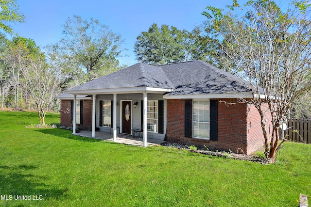 view of front of property with a patio area and a front yard