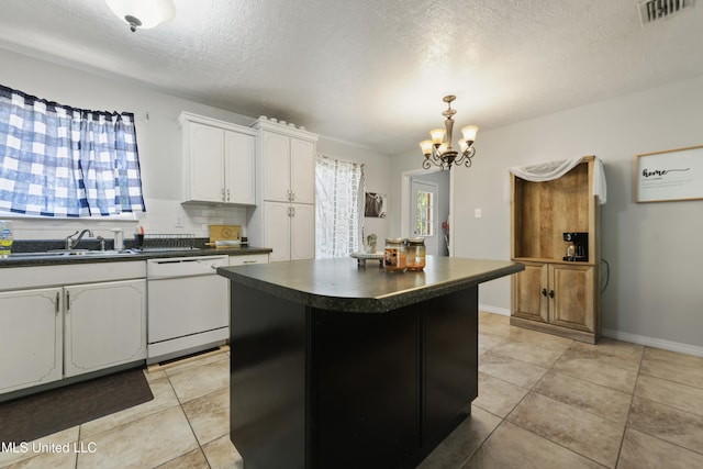 kitchen featuring white cabinets, pendant lighting, a notable chandelier, dishwasher, and a kitchen island