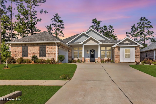 12578 Alphabet Rd, Gulfport, MS 39503 - view of front of house with concrete driveway, a garage, a front yard, and brick siding