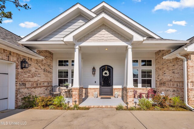 12578 Alphabet Rd, Gulfport, MS 39503 - doorway to property with covered porch and brick siding