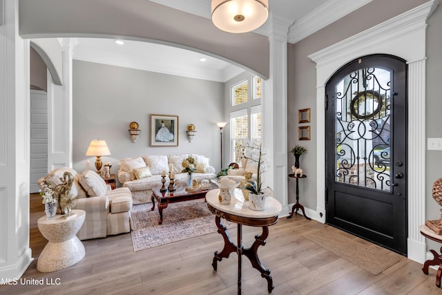 12578 Alphabet Rd, Gulfport, MS 39503 - entryway featuring arched walkways, ornamental molding, wood finished floors, ornate columns, and recessed lighting