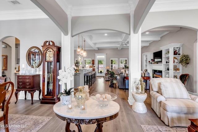 12578 Alphabet Rd, Gulfport, MS 39503 - living room with ceiling fan, hardwood / wood-style floors, a glass covered fireplace, beam ceiling, and coffered ceiling