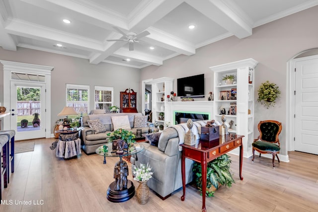 12578 Alphabet Rd, Gulfport, MS 39503 - living area featuring a ceiling fan, beamed ceiling, light wood-style floors, recessed lighting, and a glass covered fireplace