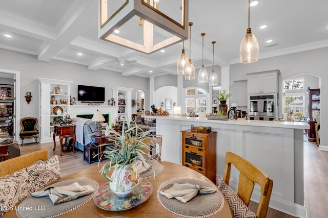 12578 Alphabet Rd, Gulfport, MS 39503 - dining space with ceiling fan, light wood-type flooring, beamed ceiling, recessed lighting, and coffered ceiling