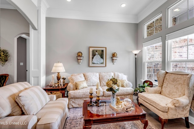 12578 Alphabet Rd, Gulfport, MS 39503 - living room with arched walkways, ornamental molding, wood finished floors, and recessed lighting