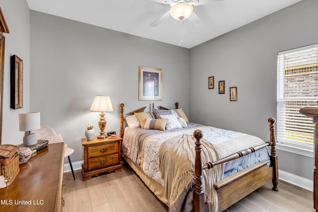 12578 Alphabet Rd, Gulfport, MS 39503 - bedroom featuring baseboards, light wood-type flooring, and ceiling fan