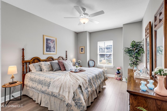 12578 Alphabet Rd, Gulfport, MS 39503 - bedroom with baseboards, wood finished floors, and a ceiling fan