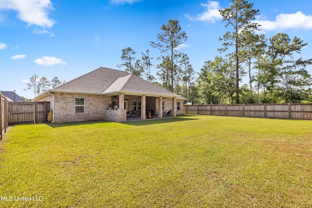 12578 Alphabet Rd, Gulfport, MS 39503 - rear view of property with brick siding, a patio area, and roof with shingles