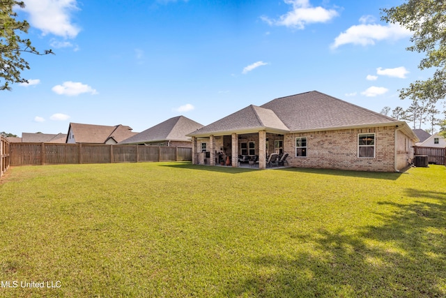 12578 Alphabet Rd, Gulfport, MS 39503 - back of property featuring brick siding, cooling unit, a patio area, and roof with shingles