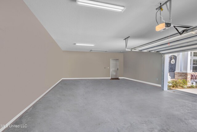 12578 Alphabet Rd, Gulfport, MS 39503 - garage with a garage door opener and baseboards