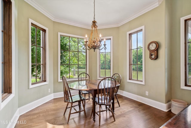 4666 Eiffel Ln, Nesbit, MS 38651 - dining space with wood finished floors, a chandelier, baseboards, and ornamental molding
