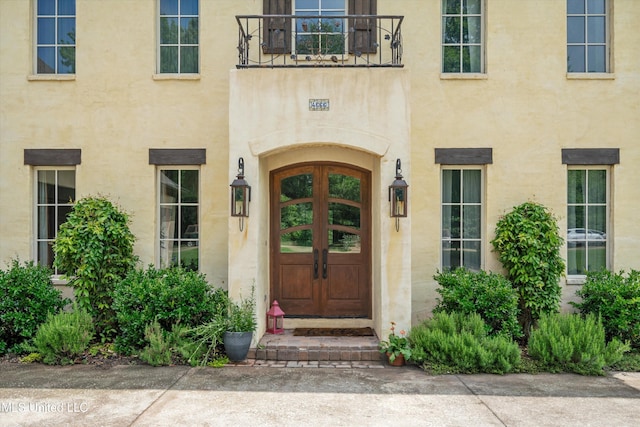 4666 Eiffel Ln, Nesbit, MS 38651 - entrance to property featuring stucco siding and a balcony