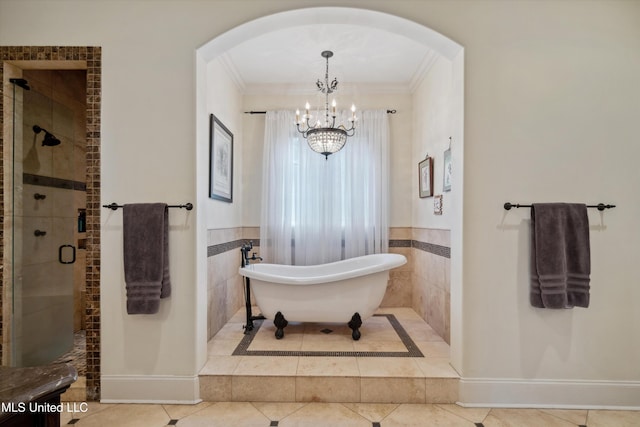 4666 Eiffel Ln, Nesbit, MS 38651 - full bath with a shower stall, a chandelier, crown molding, a soaking tub, and tile patterned floors