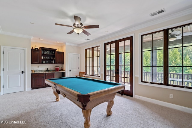4666 Eiffel Ln, Nesbit, MS 38651 - playroom featuring french doors, wet bar, light colored carpet, baseboards, and crown molding
