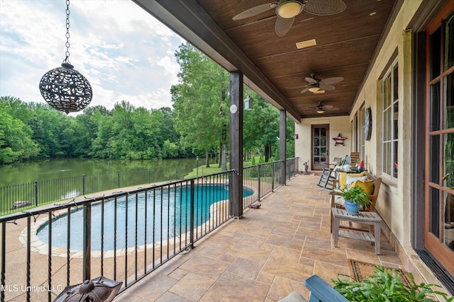 4666 Eiffel Ln, Nesbit, MS 38651 - view of patio featuring a ceiling fan, a water view, and view of scattered trees