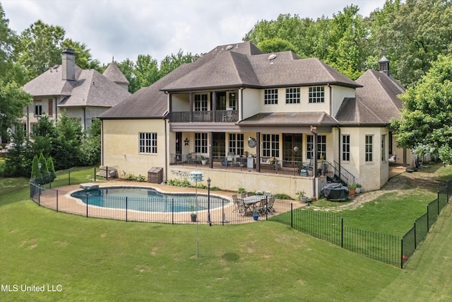 4666 Eiffel Ln, Nesbit, MS 38651 - rear view of house featuring stucco siding, a patio, a balcony, and a shingled roof