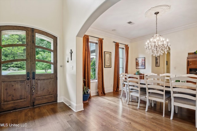 4666 Eiffel Ln, Nesbit, MS 38651 - entryway featuring arched walkways, dark wood-type flooring, french doors, baseboards, and a chandelier