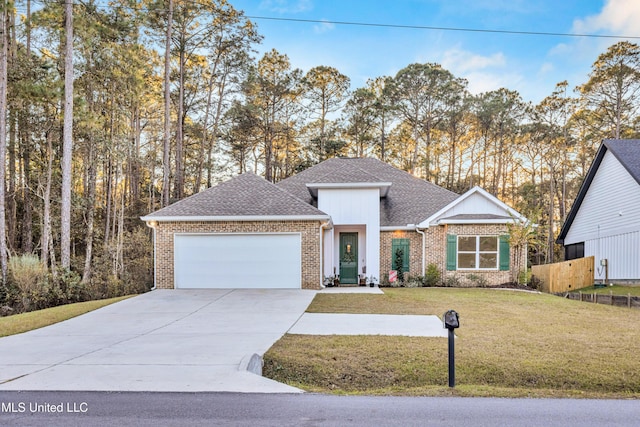 view of front of property with a garage, a front yard, and central AC