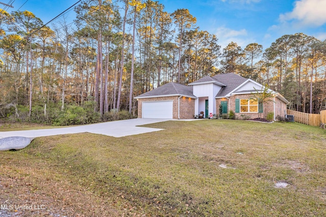 view of front of house with a garage and a front yard