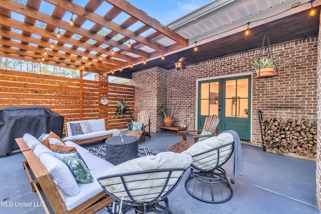 view of patio / terrace with a pergola, a grill, and an outdoor hangout area