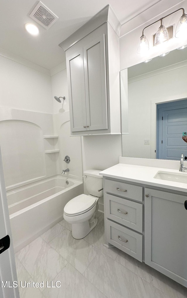 bathroom featuring marble finish floor, visible vents, toilet, washtub / shower combination, and vanity