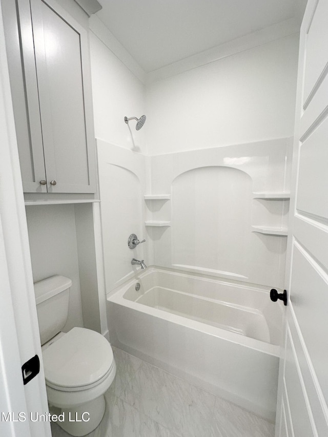 full bath featuring toilet, marble finish floor, and washtub / shower combination