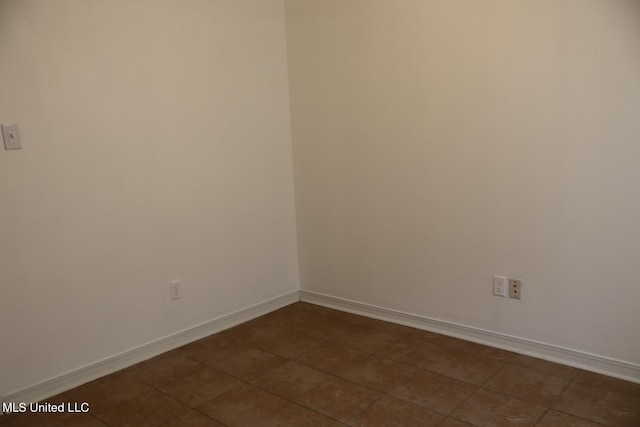 view of tiled spare room