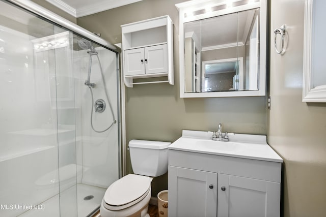 bathroom with vanity, toilet, walk in shower, and ornamental molding