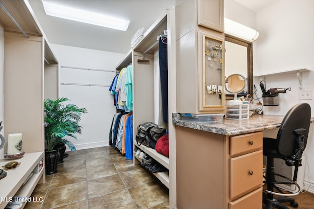 spacious closet with built in desk