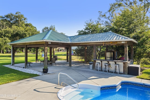 view of swimming pool featuring a yard, a gazebo, and a patio area