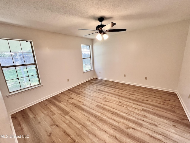 7164 Kimlee Cv, Southaven, MS 38671 - empty room featuring wood finished floors, a textured ceiling, baseboards, and a ceiling fan