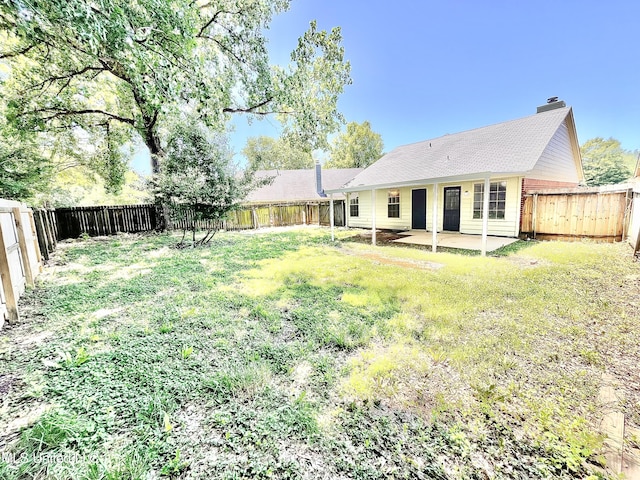 7164 Kimlee Cv, Southaven, MS 38671 - back of property with a chimney and a patio area