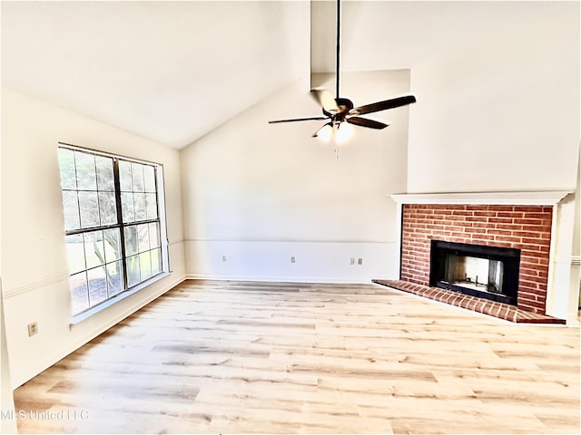 7164 Kimlee Cv, Southaven, MS 38671 - unfurnished living room with a ceiling fan, wood finished floors, a brick fireplace, and baseboards