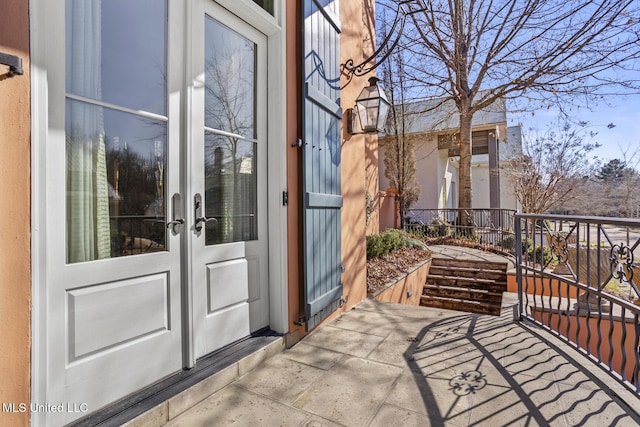 view of exterior entry featuring french doors