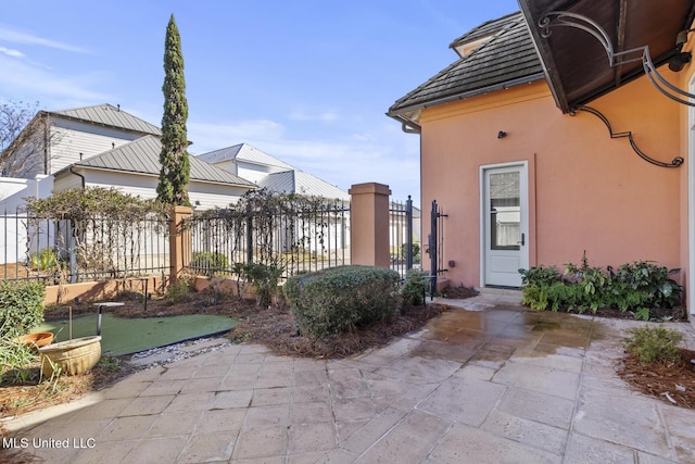 view of side of home with a patio