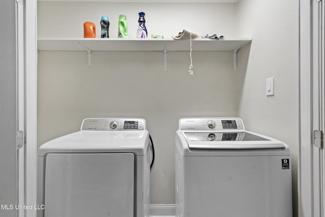 laundry area featuring washing machine and clothes dryer