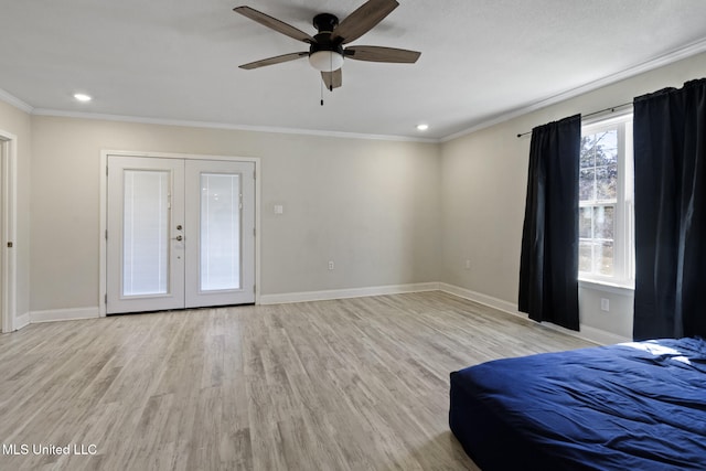 unfurnished bedroom featuring ornamental molding, french doors, ceiling fan, and light wood-type flooring