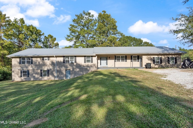 ranch-style house featuring a front lawn