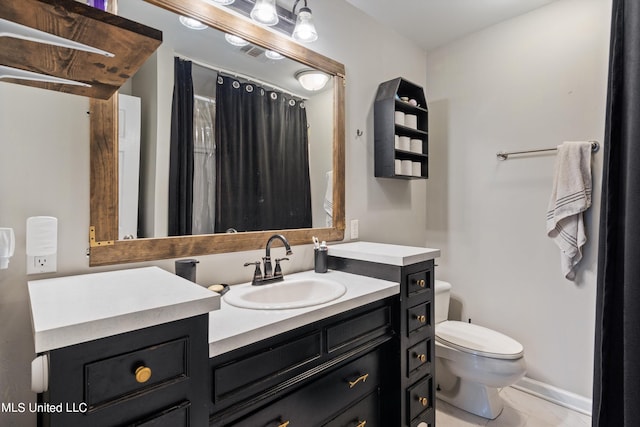 bathroom with vanity and toilet