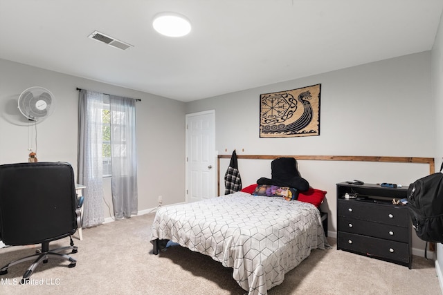 bedroom featuring light colored carpet