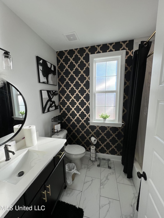 bathroom with visible vents, vanity, toilet, a shower with shower curtain, and wallpapered walls