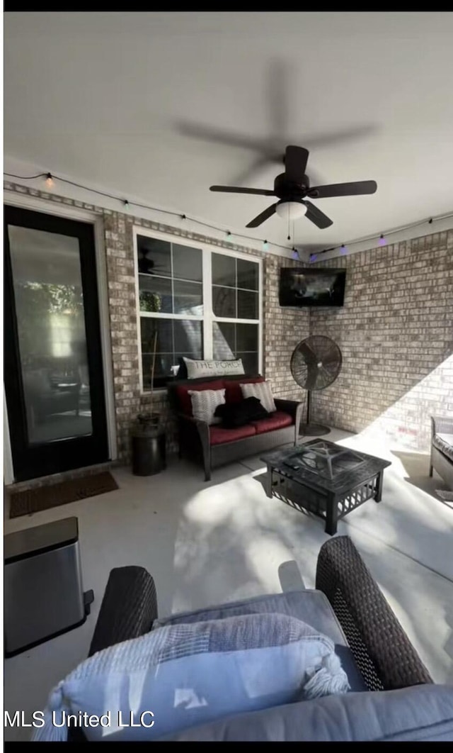 view of patio / terrace with a ceiling fan and outdoor lounge area