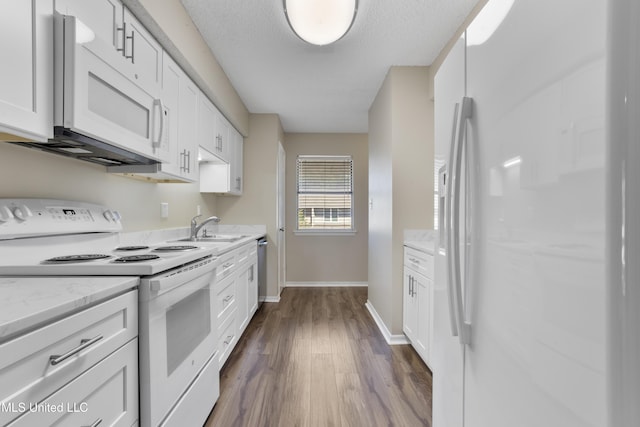 295 Highpoint Dr, Diamondhead, MS 39525 - kitchen featuring white cabinetry, a sink, baseboards, dark wood finished floors, and white appliances
