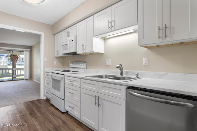 kitchen featuring a textured ceiling, white appliances, sink, dark hardwood / wood-style floors, and white cabinetry