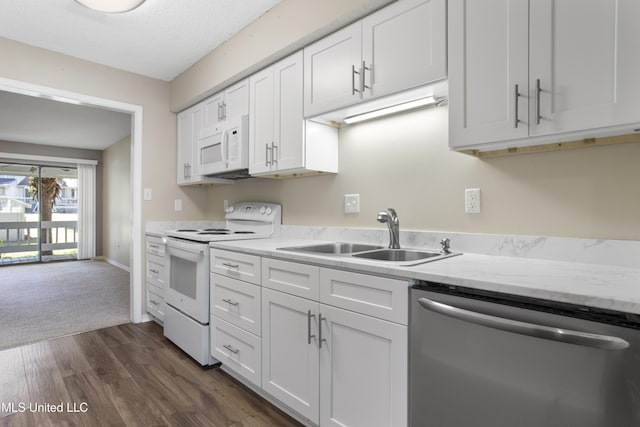 295 Highpoint Dr, Diamondhead, MS 39525 - kitchen with white cabinets, white appliances, dark wood-type flooring, and a sink
