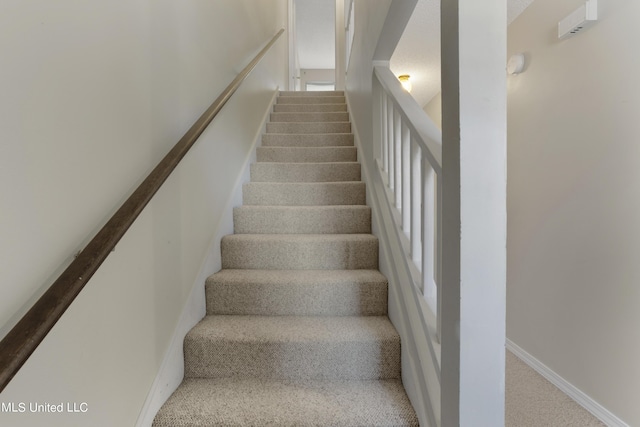 295 Highpoint Dr, Diamondhead, MS 39525 - stairs with carpet flooring and baseboards