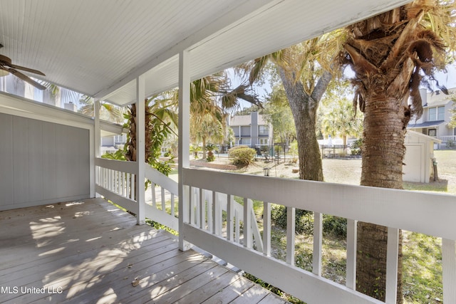 295 Highpoint Dr, Diamondhead, MS 39525 - wooden deck featuring a porch and ceiling fan