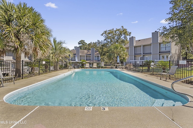 295 Highpoint Dr, Diamondhead, MS 39525 - pool with fence, a patio area, and a residential view