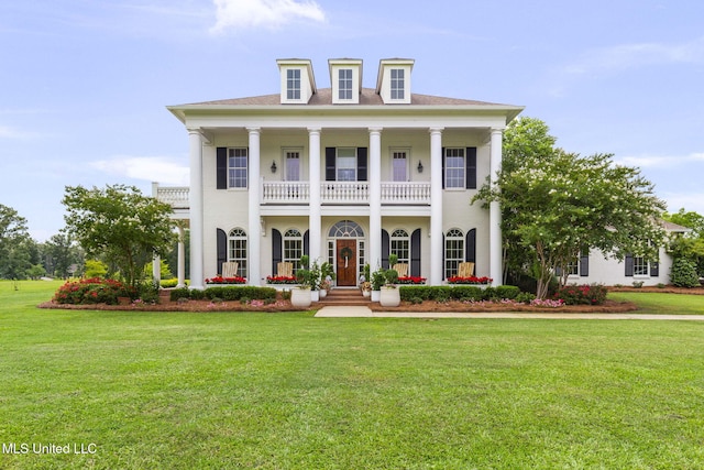1053 Woodbridge Dr, Brandon, MS 39047 - greek revival inspired property featuring a balcony, a front lawn, stucco siding, and a porch
