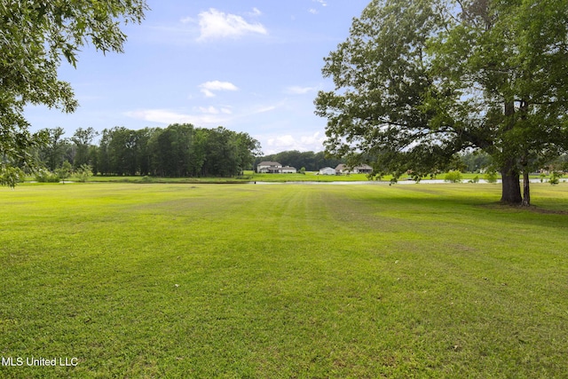 1053 Woodbridge Dr, Brandon, MS 39047 - surrounding community with a lawn and view of golf course